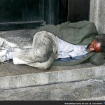 Homeless man lying on the street